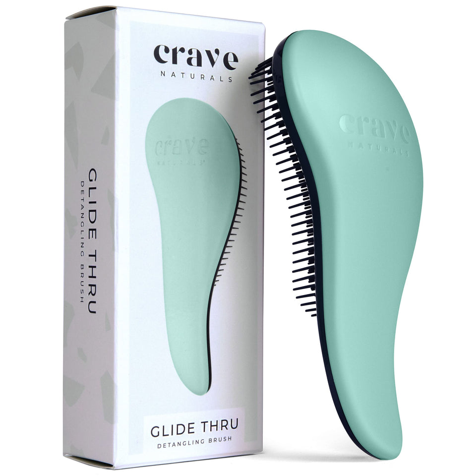 Crave Naturals front view of turquoise detangling brush, easy identification and grip benefit