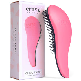 Crave Naturals front view of pink detangler brush shows compact shape and easy grip