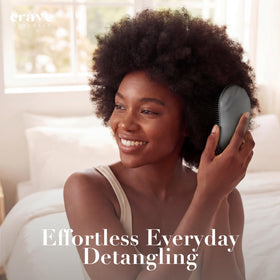 Crave Naturals brush in hand to show travel-friendly scale and control
