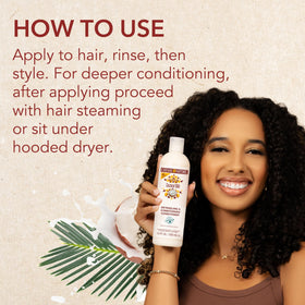 Creme of Nature shampoo in shower being applied to wet hair for cleansing benefit