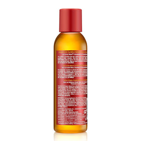 Creme of Nature serum being dispensed to protect hair from heat styling