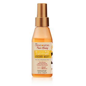 Creme of Nature mist being sprayed on hair, reduces frizz and adds gloss