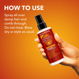 Refreshing defined curls with Creme of Nature spray to restore bounce