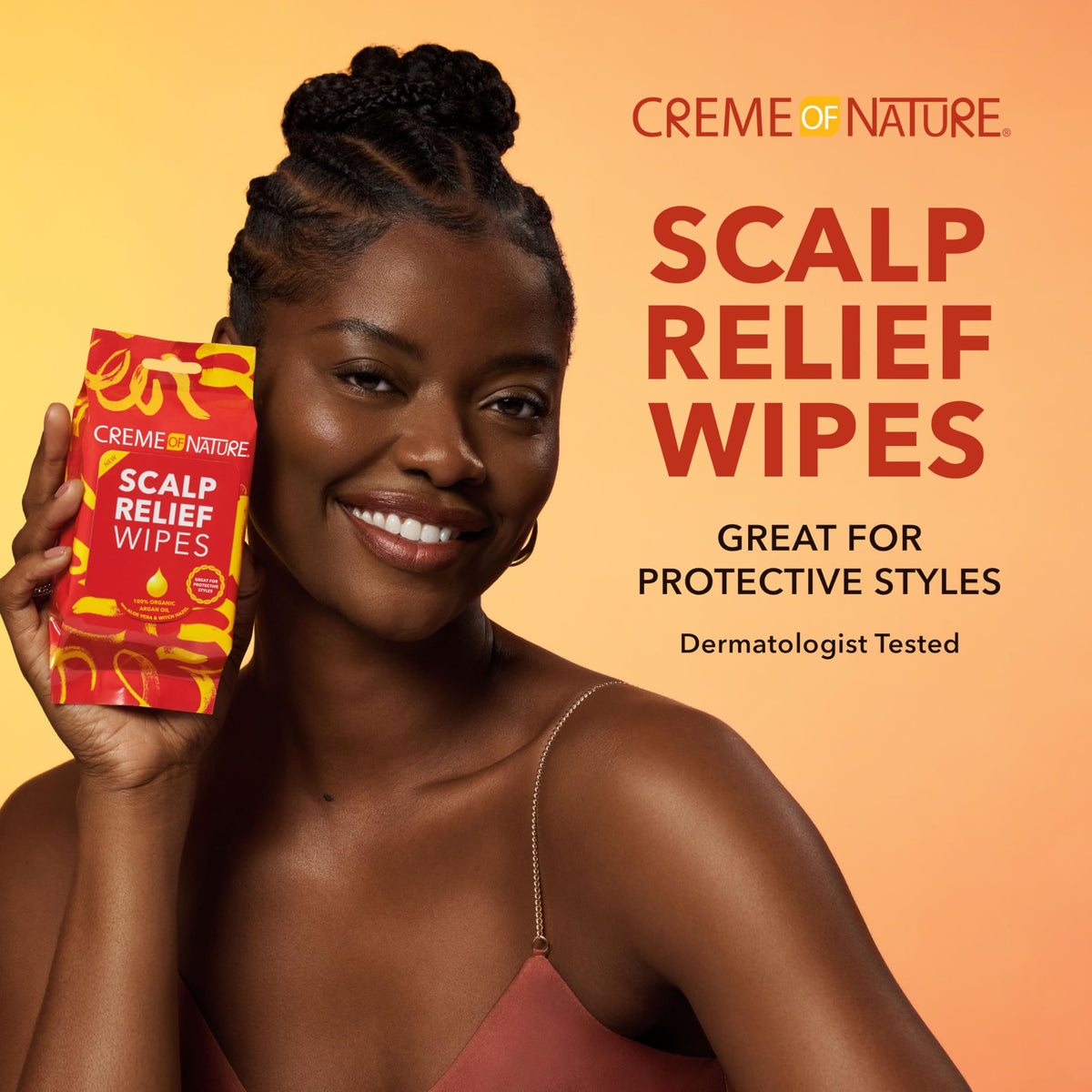 Creme of Nature wipe held in hand demonstrating easy use