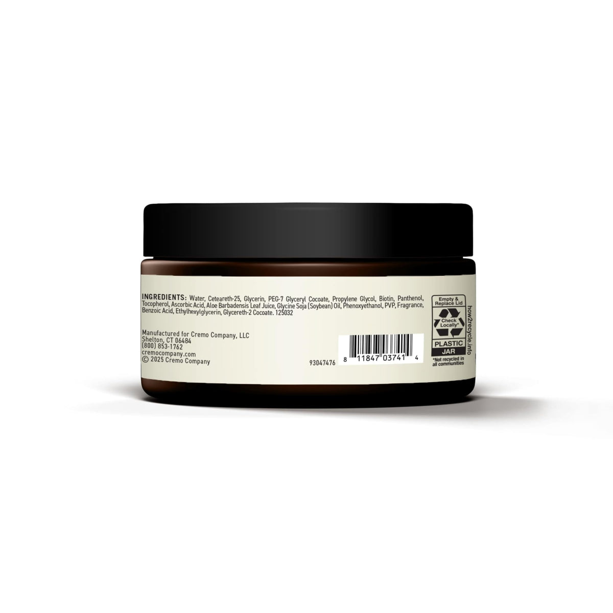 Cremo jar on barber station illustrating professional styling results