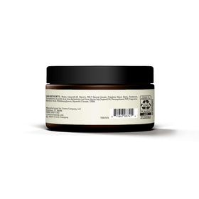 Cremo jar on barber station illustrating professional styling results