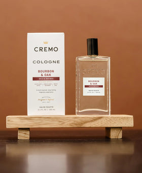 Cremo close-up of bottle label highlighting crafted fragrance notes benefit