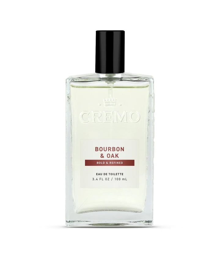Cremo bottle front view showing refined bourbon and oak fragrance benefit