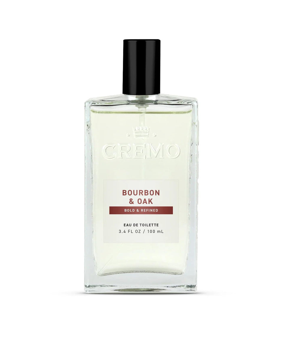 Cremo bottle front view showing refined bourbon and oak fragrance benefit