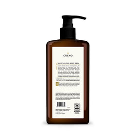 Cremo bottle next to a hand to show 32 fl oz scale and value