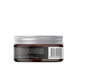 Cremo jar on bathroom counter staged for daily grooming and travel convenience