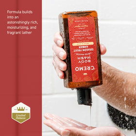 Cremo bottle held in hand to show true size and travel-friendly scale