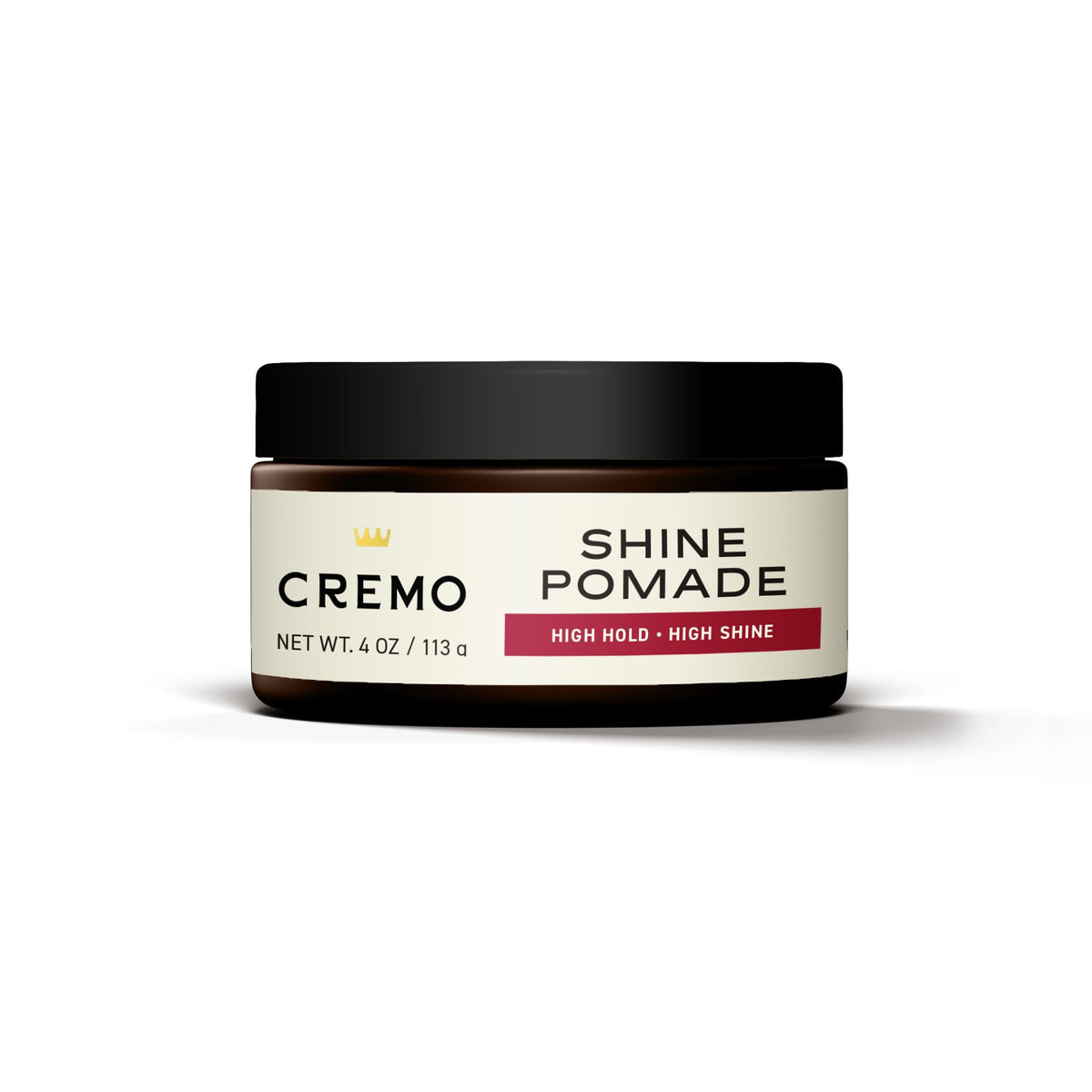Cremo in‑hand application with product on fingertips demonstrating controlled styling benefit