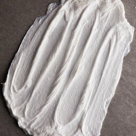 Cremo product in use with cream lathered on face for a smooth, close shave