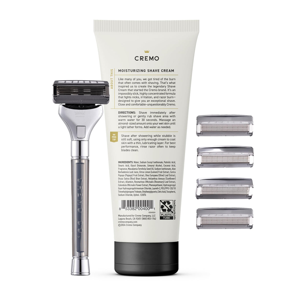Cremo razor next to common toiletries showing compact size and travel readiness