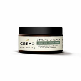 Cremo next to common items to show the 3.4 oz size for packing ease