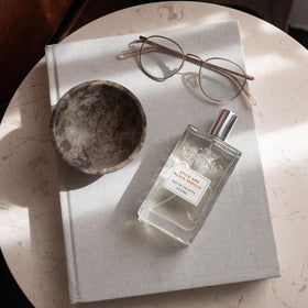 Cremo cologne displayed with matching body wash to highlight layered scent benefits
