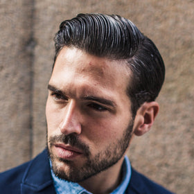 Cremo-styled slick-back haircut demonstrating polished high shine