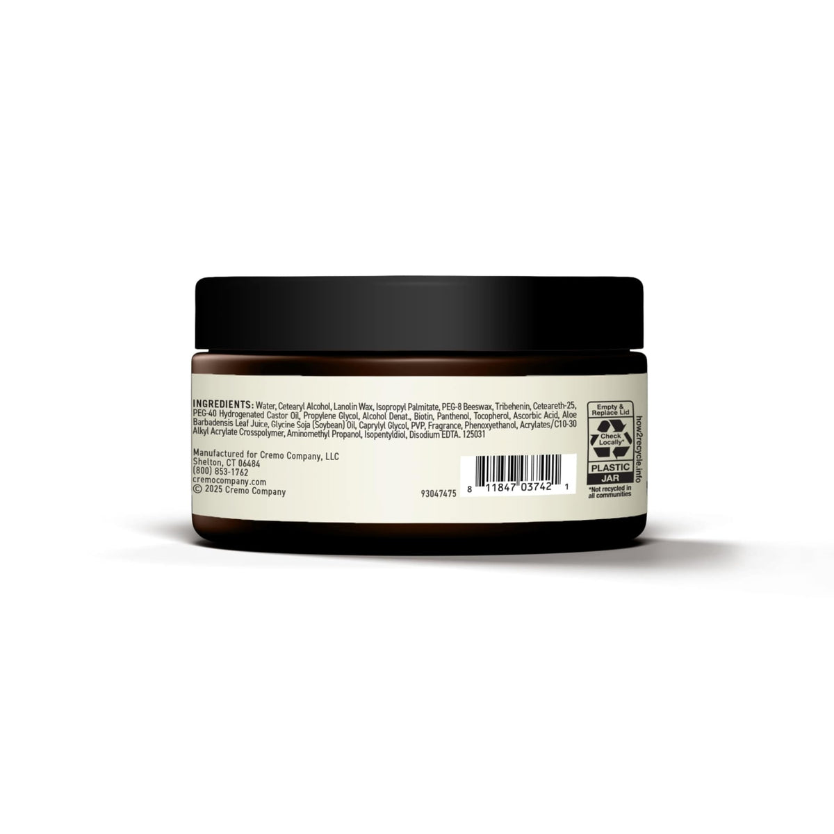 Cremo jar on barber station conveying professional salon-quality results