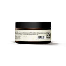 Cremo jar on barber station conveying professional salon-quality results