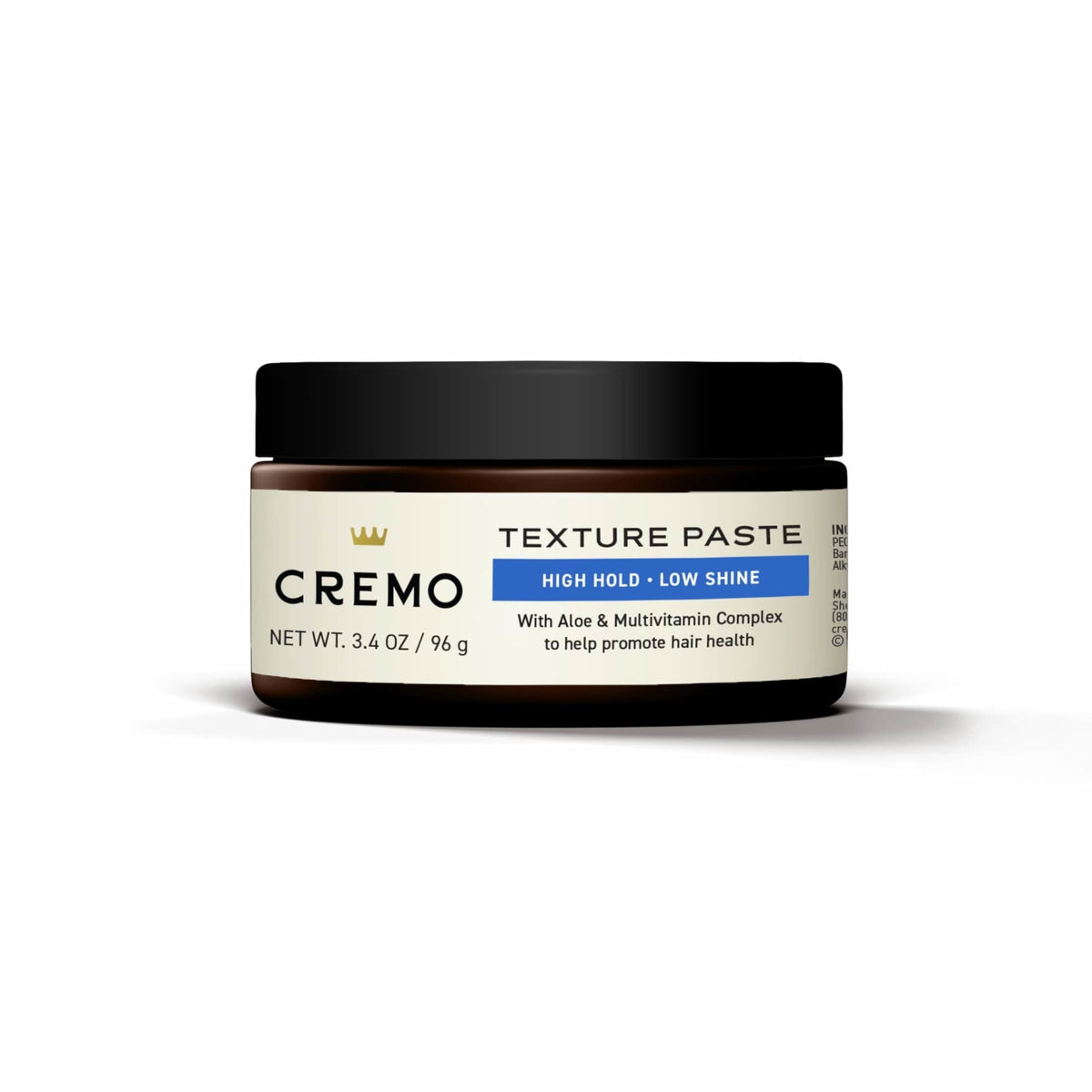 Cremo jar beside ruler showing 3.4 oz size for travel convenience