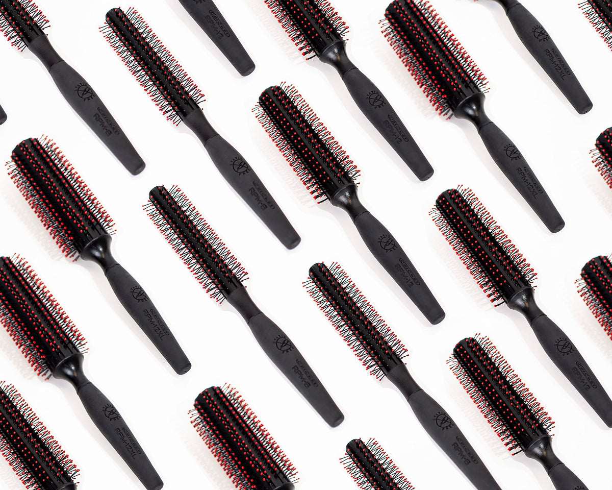 Cricket brush result on a curled hair section showing defined, polished bend
