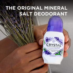Crystal Essence applying roll-on underarm for daily odor control
