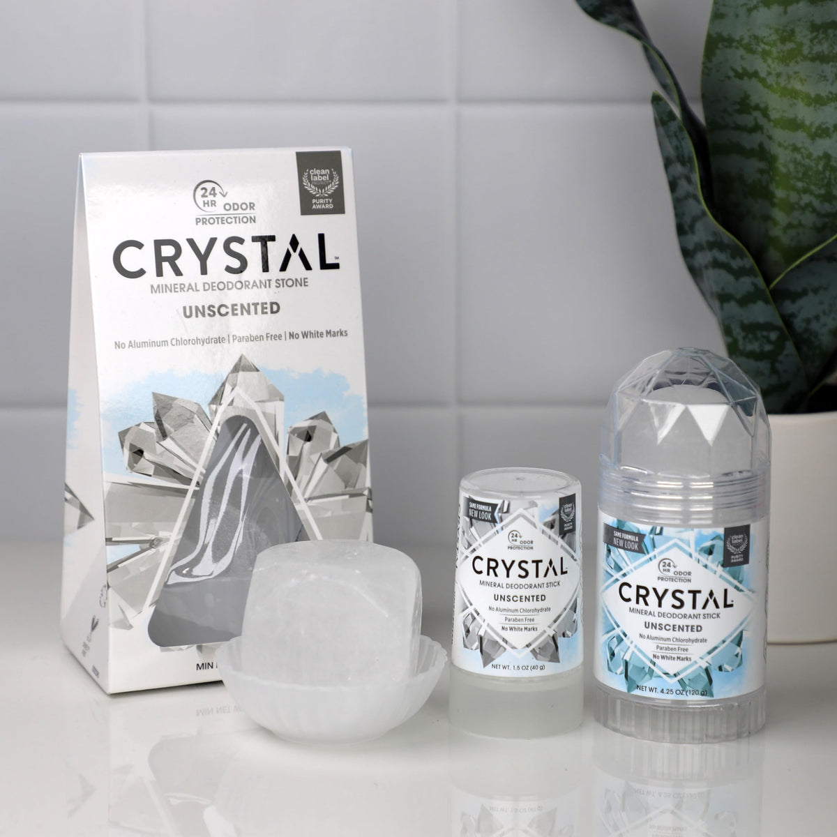 Crystal Essence stick in hand for size and easy application benefit portability
