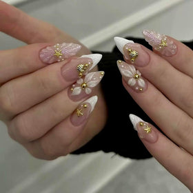 CTTHNBD close-up of shell star detail on nail, delicate decorative finish