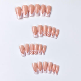 CTTHNBD close-up of white French tip and heart detail highlighting smooth gloss