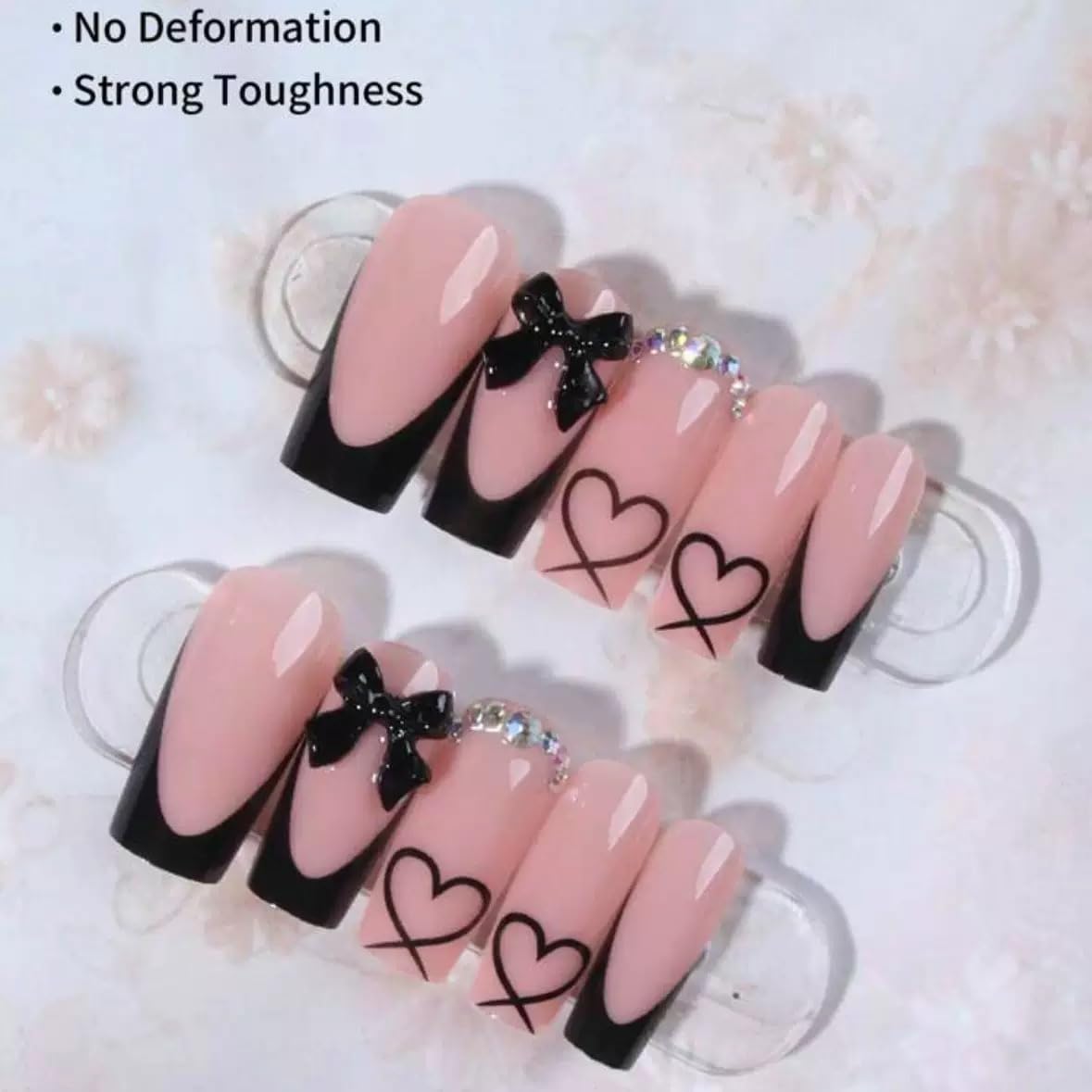CTTHNBD top view of glossy black French tips arranged by size, precise fit benefit