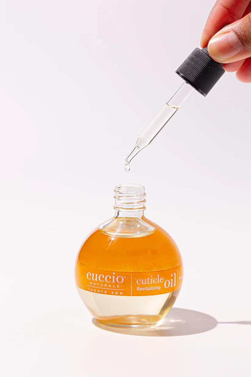 Cuccio bottle beside cold-pressed oil ingredients for natural benefit