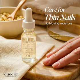 Cuccio on a vanity near towels showing spa-like at-home manicure benefit