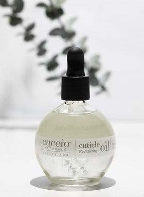Cuccio on bathroom vanity styled for at-home spa use and daily nail care