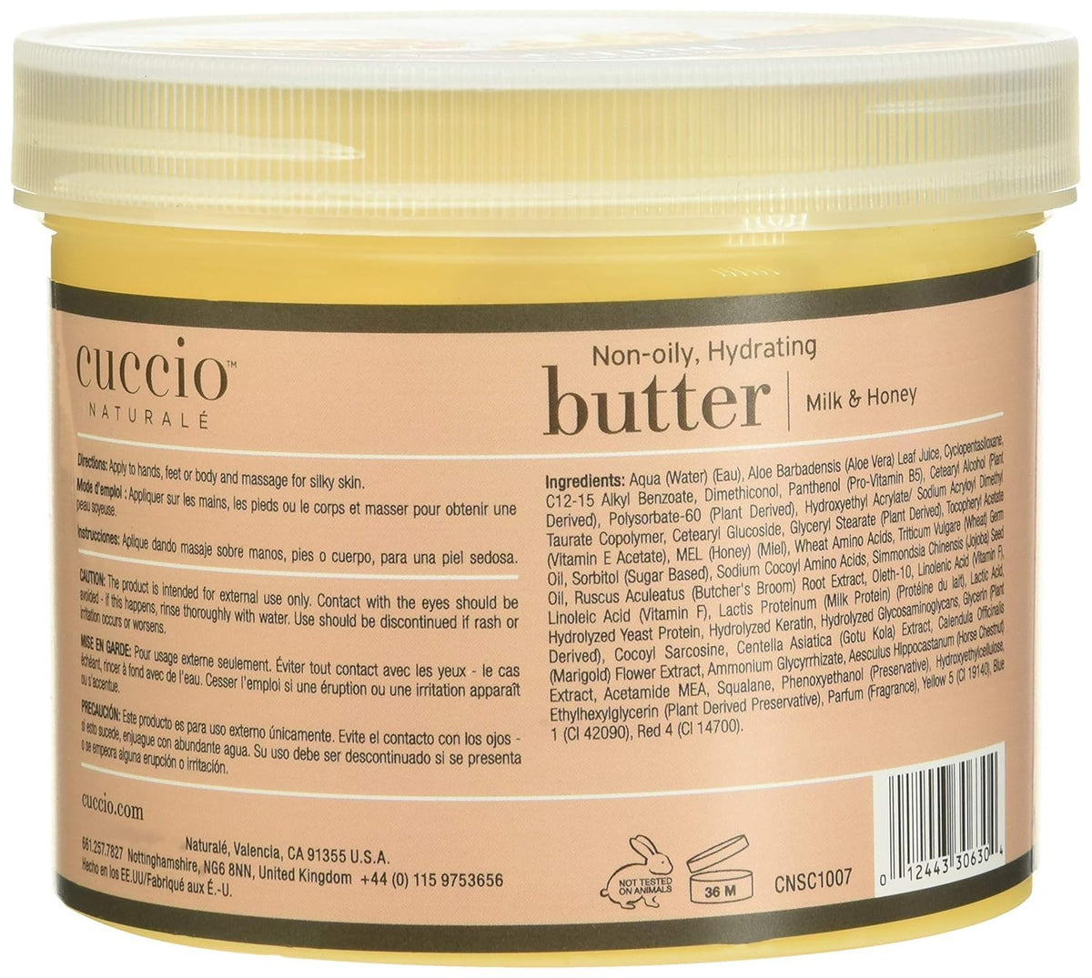Cuccio 26 oz tub next to a hand for clear size and value reference