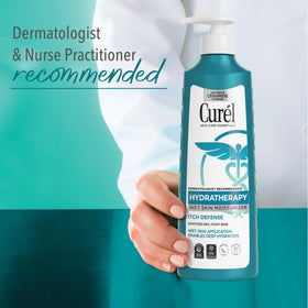 Curel hands spreading lotion on damp skin for soothing moisturization benefit