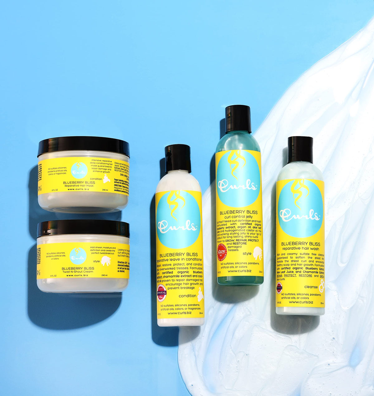 Curls Blueberry Bliss on bathroom shelf styled with towels showing everyday use and routine convenience