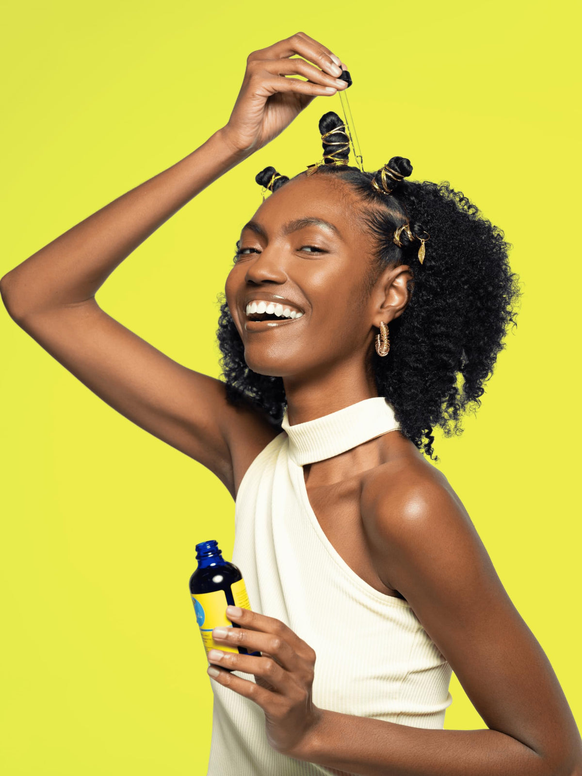 Curls bottle held in hand showing 4 oz scale and travel-friendly convenience benefit