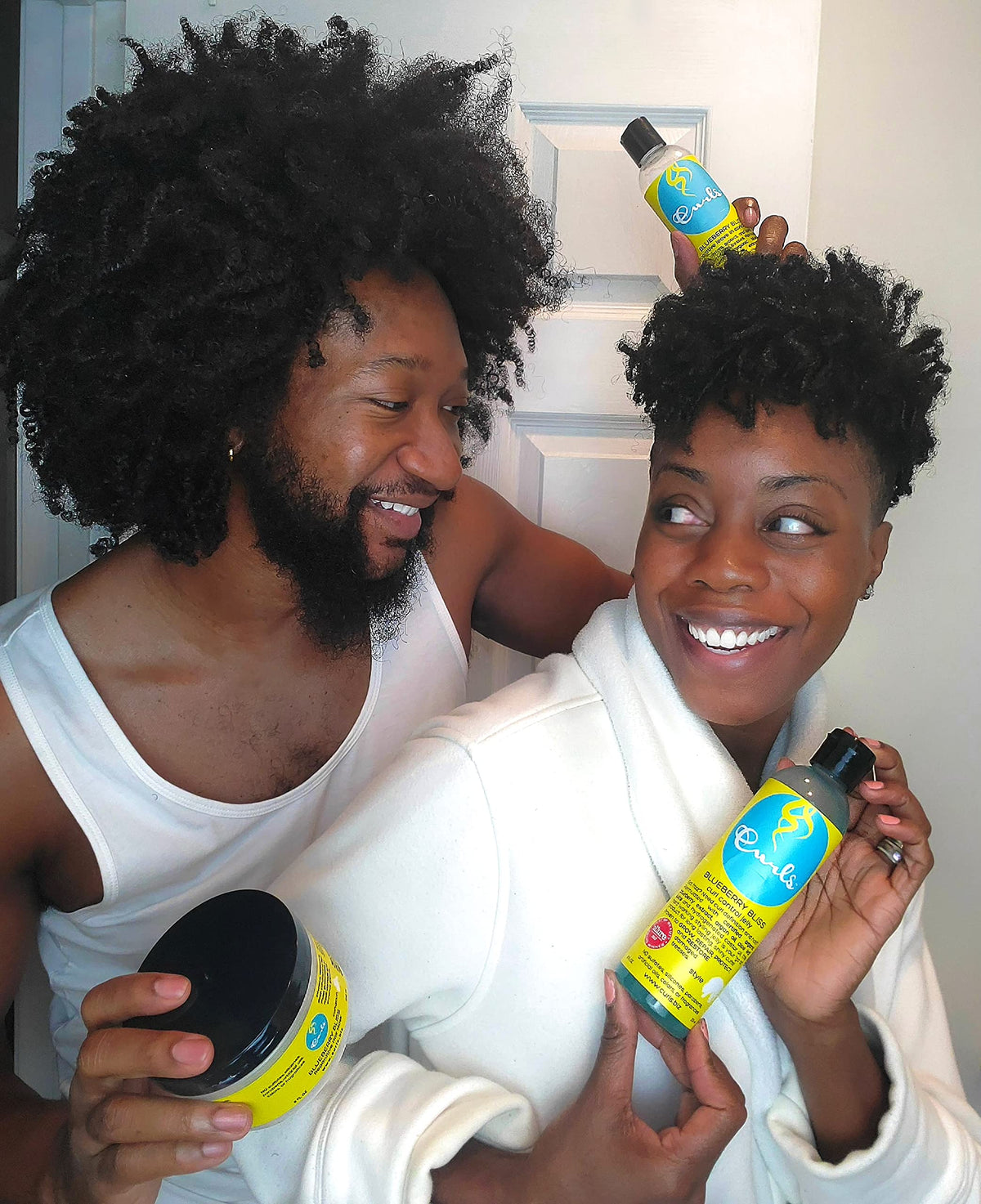 Model wearing wash-and-go styled with Curls Blueberry Bliss showcasing defined frizz-free curls