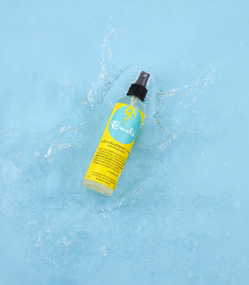 CURLS spray mist close-up displaying fine texture and even coverage