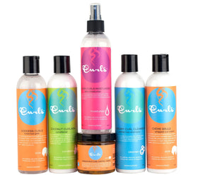 Curls Goddess container next to hand for size comparison and easy travel