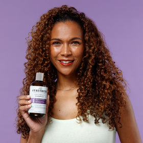 CURLSMITH in-shower use on curly hair demonstrating gentle cleanse