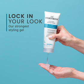 CURLSMITH diffusing curly hair in lifestyle scene showing defined bounce