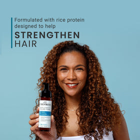 CURLSMITH applying foam at roots to boost lift and volumize curls