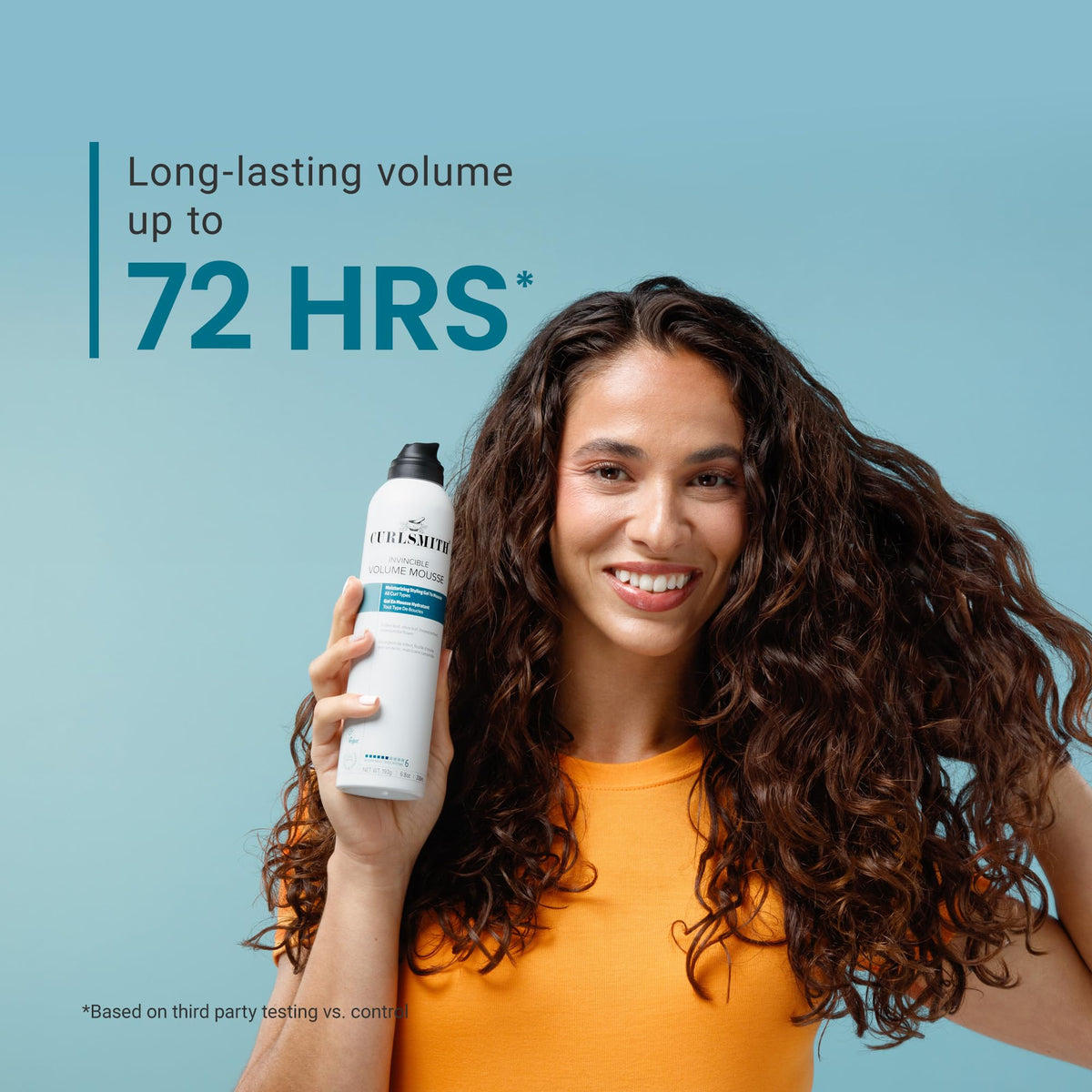 CURLSMITH applying mousse to damp hair, helps create lift at roots