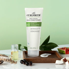 CURLSMITH duo displayed on a bathroom vanity for daily routine inspiration