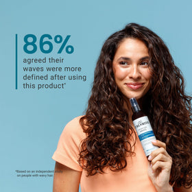 CURLSMITH model with beachy waves outdoors, conveys natural movement benefits