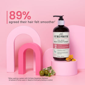 CURLSMITH applying conditioner in shower for smoother, detangled hair