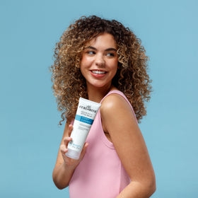 CURLSMITH 8 oz jar in hand showing true size for travel planning