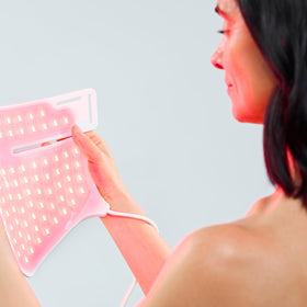 CurrentBody model wearing mask on chest demonstrating hands-free treatment benefit